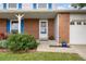 Inviting front porch showcasing brick facade, bright blue shutters, and a cozy bench, perfect for relaxing at 3308 W 11Th Avenue Pl, Broomfield, CO 80020