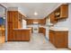 Spacious kitchen features wood cabinets, white appliances, and neutral countertops at 3308 W 11Th Avenue Pl, Broomfield, CO 80020