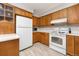 Bright kitchen with plenty of cabinet space and modern white appliances at 3308 W 11Th Avenue Pl, Broomfield, CO 80020