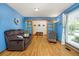 Cozy living room with hardwood floors, comfortable seating, and French doors leading to another room at 3308 W 11Th Avenue Pl, Broomfield, CO 80020