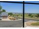 A charming blue home with a two-car garage is situated across from a scenic street with mountain views at 3308 W 11Th Avenue Pl, Broomfield, CO 80020