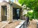 Charming home with a stone front porch and black metal railings at 11282 Osage N Cir # F, Northglenn, CO 80234
