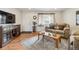 Living room with hardwood floors and comfortable seating at 1947 E 117Th Way, Northglenn, CO 80233