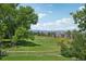Beautiful backyard with views of the greenbelt and distant mountains creates a serene outdoor oasis at 9325 Utica St, Westminster, CO 80031