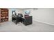 Finished basement office space features gray carpet, a built in bookshelf, a desk and a comfortable leather chair at 9325 Utica St, Westminster, CO 80031
