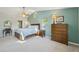 Bright bedroom with large bed, multiple windows, and ample dresser storage space at 9325 Utica St, Westminster, CO 80031