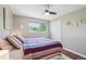Bright bedroom with colorful accents and large windows offering neighborhood views at 9325 Utica St, Westminster, CO 80031