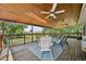Well-furnished deck features seating and ceiling fans, offering an ideal space for outdoor relaxation and entertaining at 9325 Utica St, Westminster, CO 80031