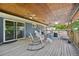Spacious deck features chairs, ceiling fans, and outdoor furniture, offering an ideal space for entertaining at 9325 Utica St, Westminster, CO 80031