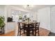 Bright dining area adjacent to a modern kitchen, illuminated by recessed lighting at 9325 Utica St, Westminster, CO 80031