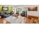 Comfortable living room with a bay window, hardwood floors, and cozy seating furniture at 9325 Utica St, Westminster, CO 80031