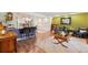 Spacious living room flows into the open kitchen area, featuring hardwood floors and open floorplan at 9325 Utica St, Westminster, CO 80031