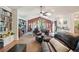 Inviting living room with vaulted ceiling, skylights, and a cozy dining area at 9325 Utica St, Westminster, CO 80031