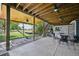 Enjoyable covered patio features an outdoor dining area, grill, staircase, and a comfortable hammock for relaxation at 9325 Utica St, Westminster, CO 80031