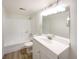 Updated bathroom with a large vanity and a shower/tub combo at 1825 Kendall St # 215, Lakewood, CO 80214