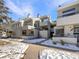 Attractive exterior of a multi-unit building with snow-covered walkways at 1825 Kendall St # 215, Lakewood, CO 80214