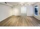 Living room with vinyl plank flooring and access to other rooms at 1825 Kendall St # 215, Lakewood, CO 80214
