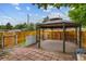 Backyard patio featuring gazebo with wood fence at 999 Osceola St, Denver, CO 80204