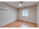 Serene bedroom showcasing wood floors, a modern ceiling fan and natural light from the window at 999 Osceola St, Denver, CO 80204