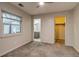 Bedroom with carpet flooring, adjacent bathroom and walk-in closet at 999 Osceola St, Denver, CO 80204
