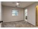 Bedroom with neutral walls, ceiling fan, carpet floors, and window at 999 Osceola St, Denver, CO 80204
