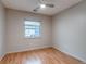 Bright bedroom featuring a ceiling fan, wood floors, and a window letting in natural light at 999 Osceola St, Denver, CO 80204
