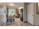 Functional kitchen and dining space with tile flooring, backyard access, and essential appliances at 999 Osceola St, Denver, CO 80204
