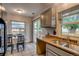 Kitchen with sliding glass door leading to a backyard and natural light at 999 Osceola St, Denver, CO 80204