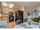 Open kitchen and dining area, featuring modern appliances and ample counter space at 999 Osceola St, Denver, CO 80204
