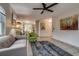 Open-concept living room showcases neutral color palette, tile floors, and seamless flow to dining area at 999 Osceola St, Denver, CO 80204