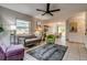 Bright living room features stylish furnishings, a ceiling fan, and neutral tile flooring at 999 Osceola St, Denver, CO 80204