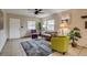 Cozy living room featuring tile floors, natural lighting, and comfortable seating arrangement at 999 Osceola St, Denver, CO 80204
