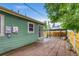 Back patio with brick pavers, a wooden gazebo, and a fenced-in yard, perfect for outdoor enjoyment at 999 Osceola St, Denver, CO 80204