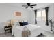 Comfortable bedroom with white bedding, dark curtains, and a small bedside table at 1 N Pearl St # 201, Denver, CO 80203