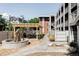 Outdoor area with modern pergola with dining seating, a fountain, and well maintained landscaping at 1 N Pearl St # 201, Denver, CO 80203