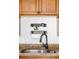 Close-up shot of a kitchen sink with granite countertops, stainless steel sink, and modern faucet at 1 N Pearl St # 201, Denver, CO 80203