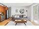 Stylish living room featuring a comfortable sofa, modern coffee table, and plenty of natural light at 1 N Pearl St # 201, Denver, CO 80203