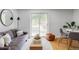 Cozy living room featuring a sliding glass door, comfortable seating, and modern decor at 1 N Pearl St # 201, Denver, CO 80203