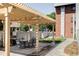Pergola over patio with stone pavers and outdoor seating perfect for relaxing or outdoor dining at 1 N Pearl St # 201, Denver, CO 80203