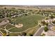 Aerial view of the neighborhood featuring a park with a playground and walking trails at 11842 Altura St, Commerce City, CO 80603