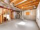 Unfinished basement with concrete floor, exposed wood ceiling and metal ductwork, and visible utility equipment at 11842 Altura St, Commerce City, CO 80603
