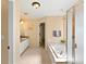 Clean bathroom showcasing a soaking tub, shower, and a vanity with ample counter space at 11842 Altura St, Commerce City, CO 80603