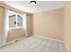 Bedroom featuring neutral carpet and a window providing natural light at 11842 Altura St, Commerce City, CO 80603