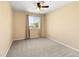 Inviting bedroom with a large window offering natural light and plush carpeting at 11842 Altura St, Commerce City, CO 80603