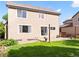 Back exterior view of the house, highlighting the siding and windows at 11842 Altura St, Commerce City, CO 80603