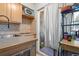 Compact kitchen featuring a window and adequate cabinet space at 1021 Carr St # 17, Lakewood, CO 80214
