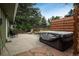 Relaxing backyard patio with hot tub, seating, stone and concrete features at 11805 W 74Th Ave, Arvada, CO 80005