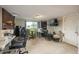 Versatile basement space with sewing area, fireplace, and large window for natural light at 11805 W 74Th Ave, Arvada, CO 80005