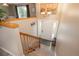 Inviting entryway features wood-look flooring, staircase, and natural light from the front door at 11805 W 74Th Ave, Arvada, CO 80005