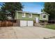 Charming home with a two-car garage, front yard and mature trees at 11805 W 74Th Ave, Arvada, CO 80005